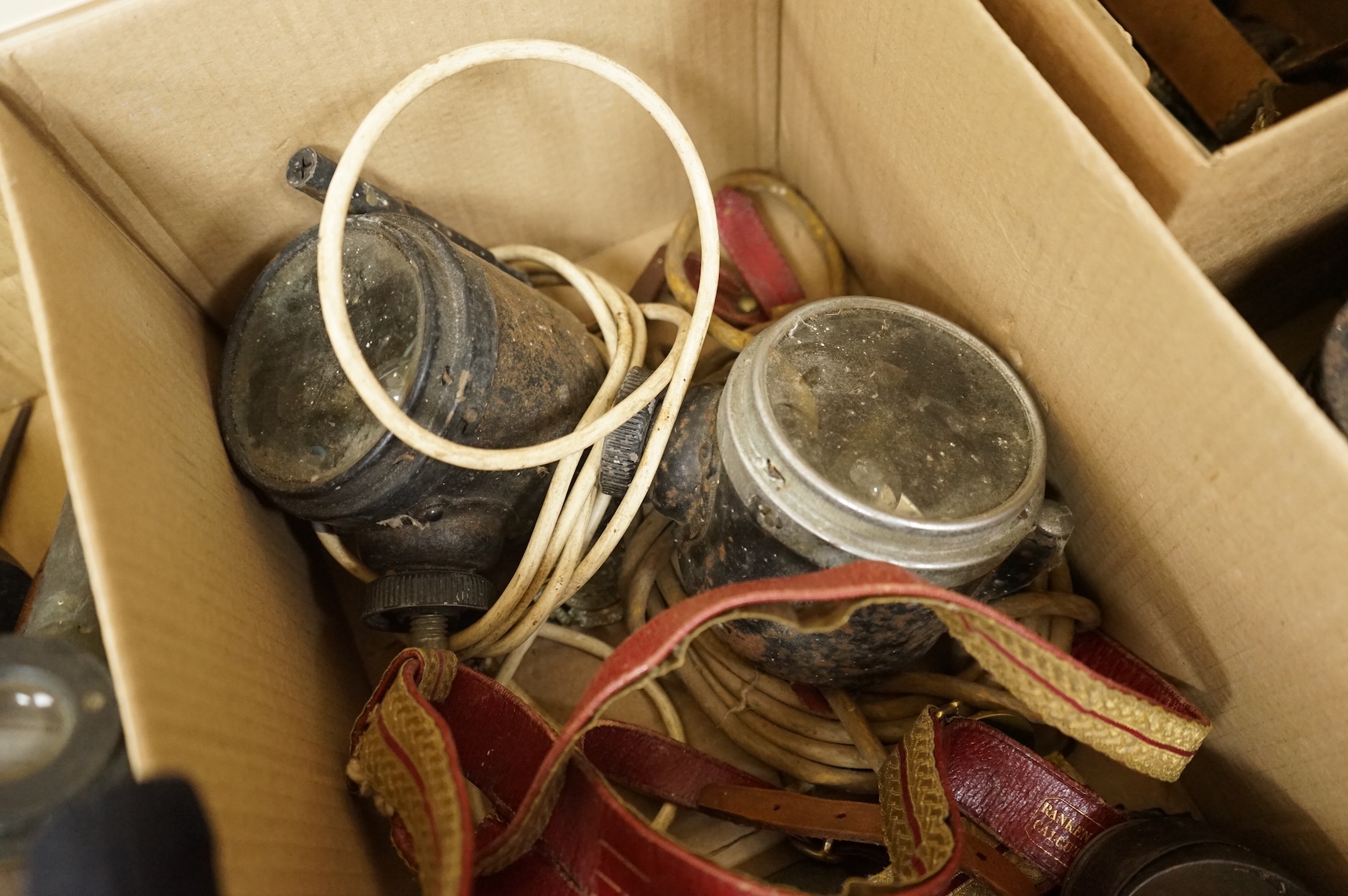 A collection of militaria including; a US Air Force camera Type N-6, a leather cased Bell & Howell Sportster camera and accessories, a pair of periscope binoculars, a leather cased compass by Goerz, Berlin